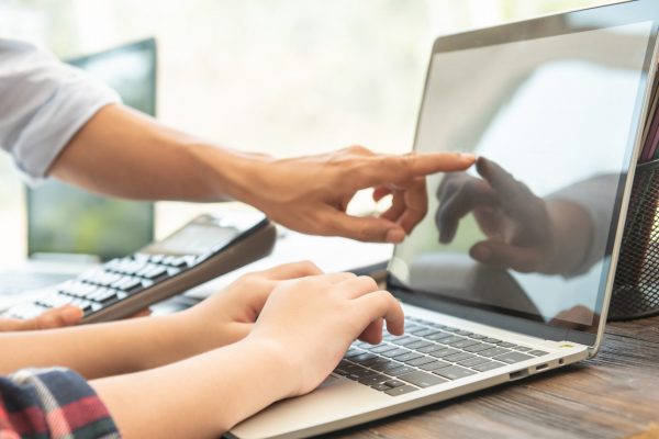 Business woman typing on laptop at workplace Woman working in office hand keyboard.teamwork process.business people discussing the charts and graphs showing the results they are successful cooperation