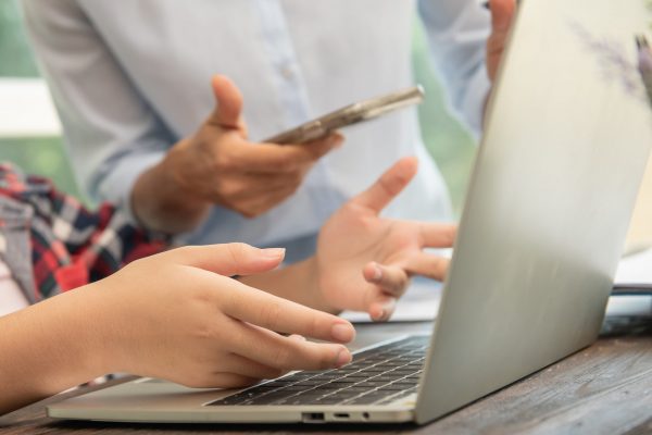 Business woman typing on laptop at workplace Woman working in office hand keyboard.teamwork process.business people discussing the charts and graphs showing the results they are successful cooperation