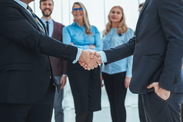 close up. business people shaking hands with each other. concept of partnership