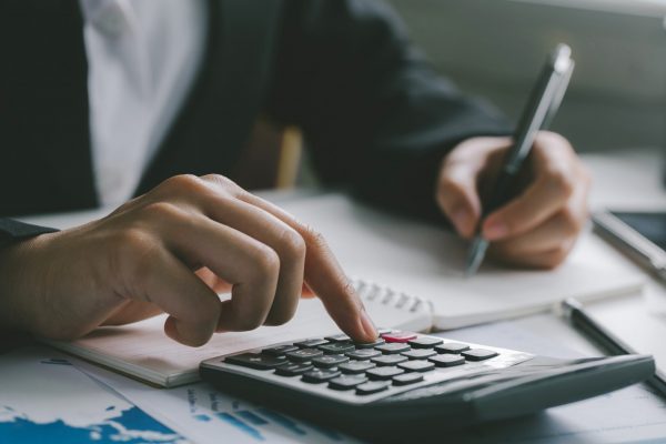 Close up of businessman accountant or banker making calculations.Business Financing Accounting Banking Concept