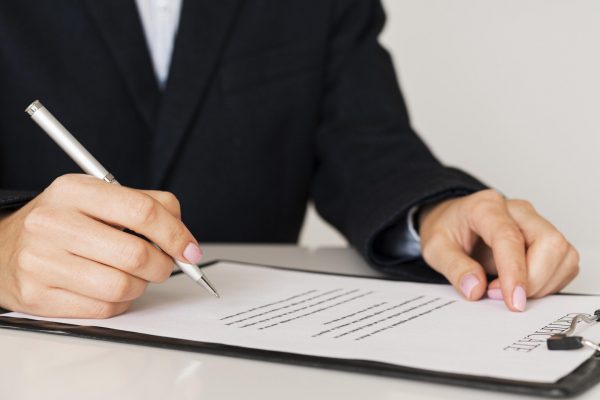 person-signing-a-certificate-front-view